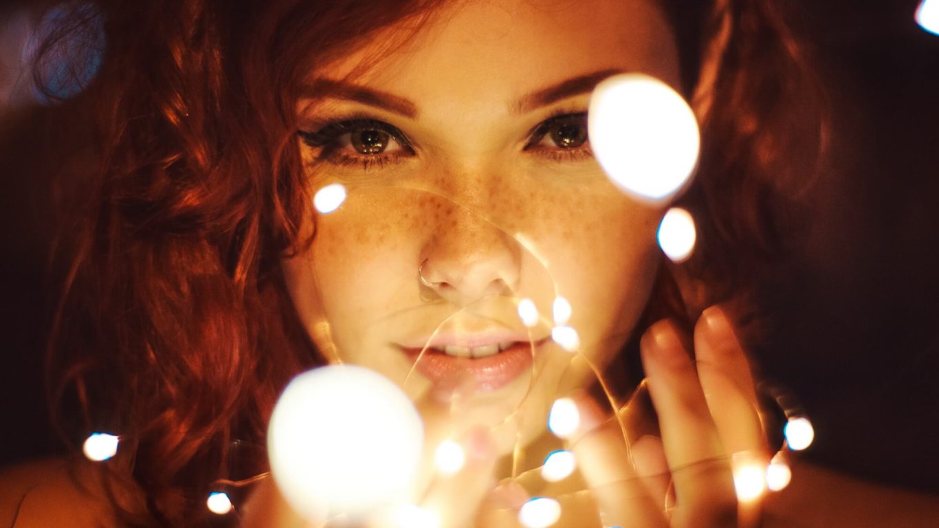 photography-of-a-woman-holding-lights-799420
